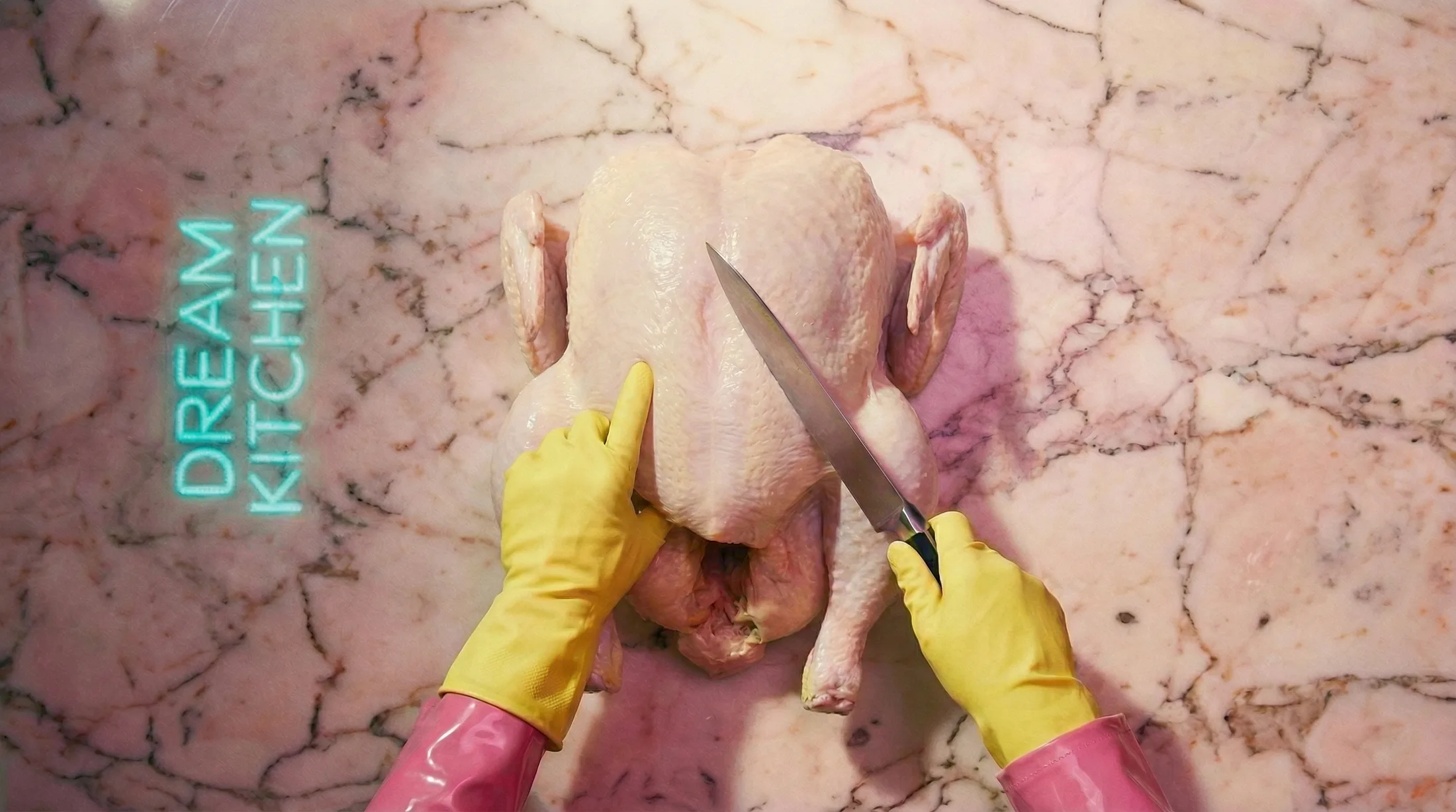 A whole raw chicken on the pink marble, kitchen knife, yellow gloves, Dream Kitchen neon